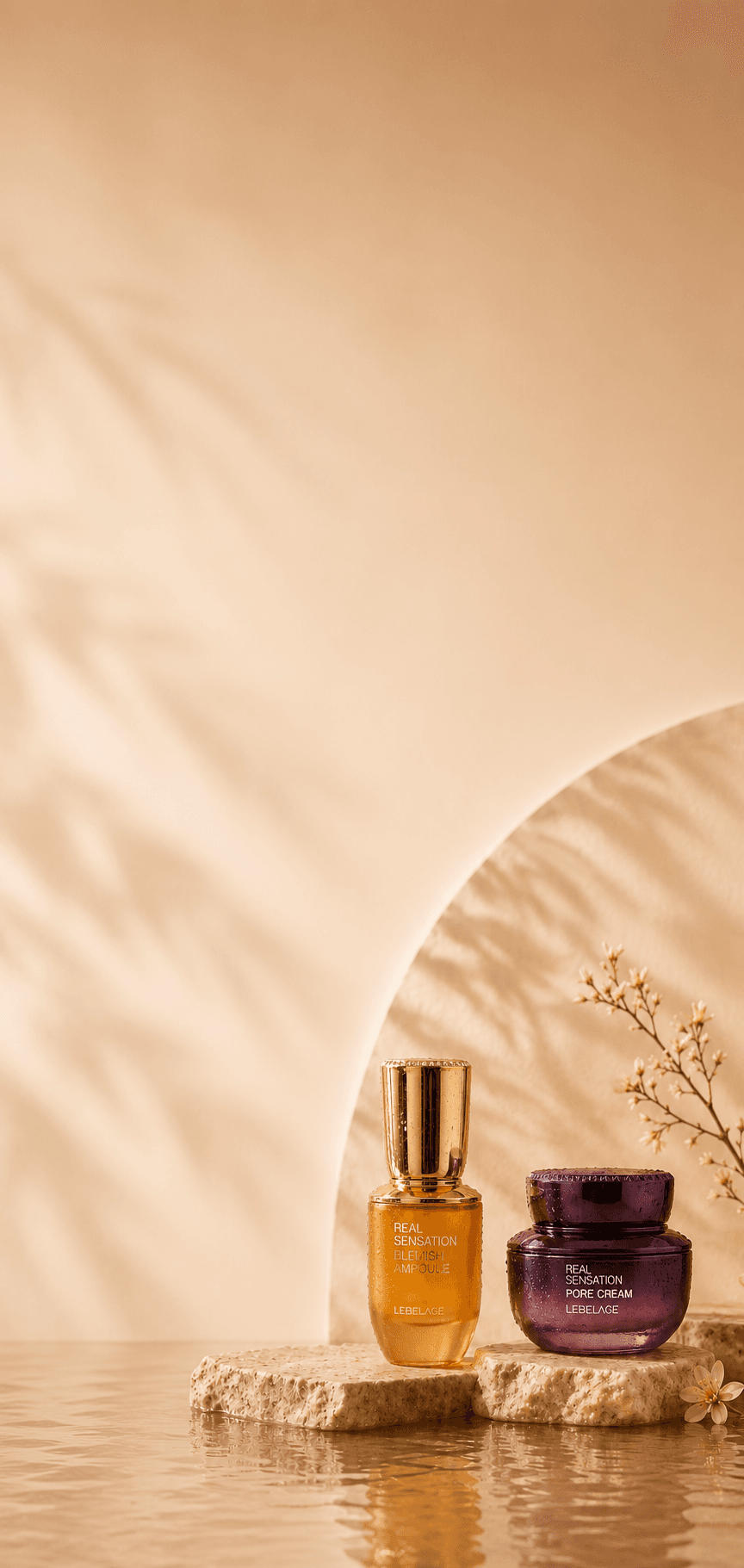 Lebelage Real Sensation Blemish Ampoule and Pore Cream staged on stone with cherry blossom